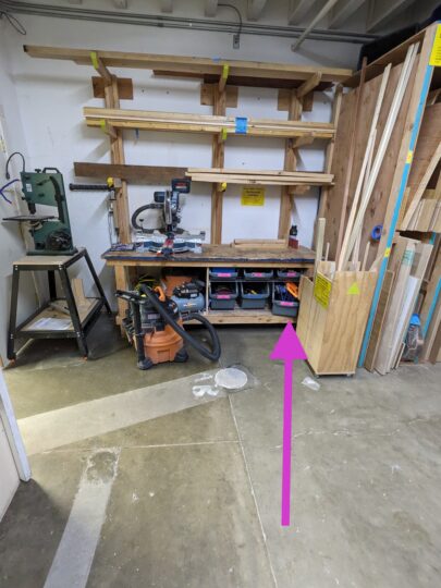 Arrow pointing to the location of the plywood dolly.