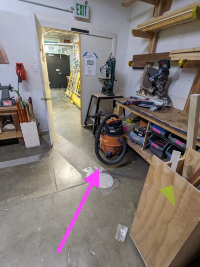 Arrow pointing to the location of the shop vacuum