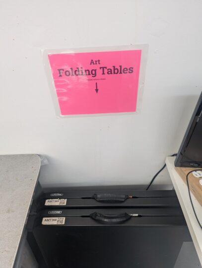 black folding table in storage area