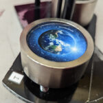 button maker with blue earth art