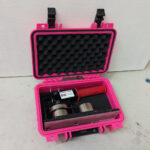 pink case with foam holding a steel button maker